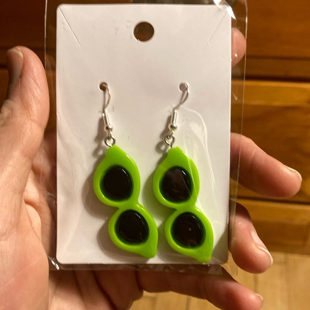 Green “Sunglasses” earrings.